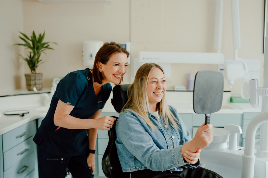 A patient seeing her finished result
